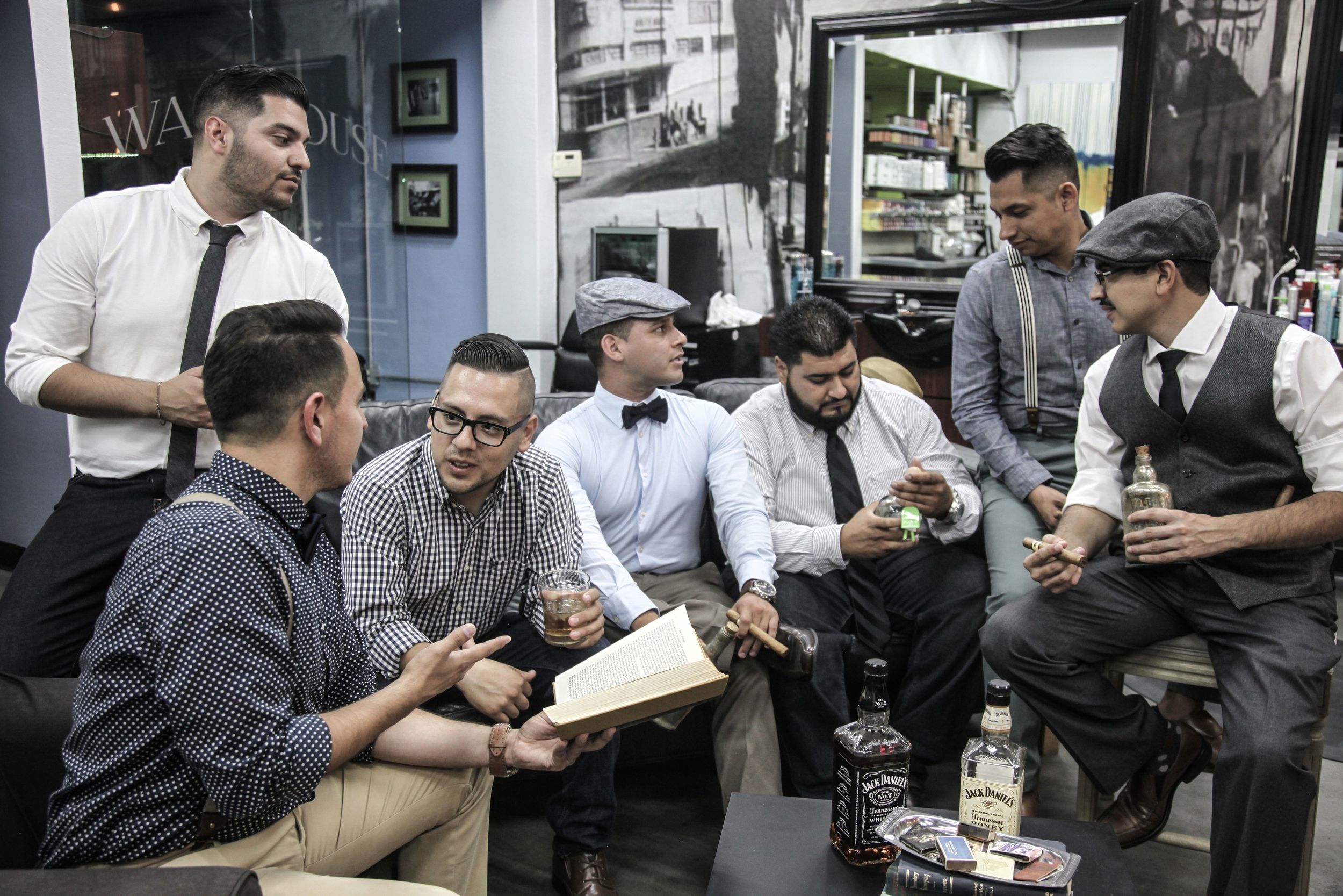group of men having a discussion while drinking